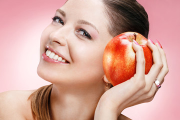 Young beautiful girl with apple