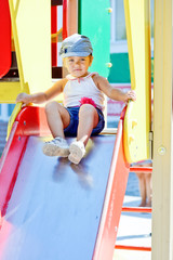 cute toddler girl on the slide