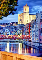 Naklejka premium Girona by night with cathedral and decorated bridge 2