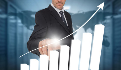 Businessman touching bar chart interface with world map on backg