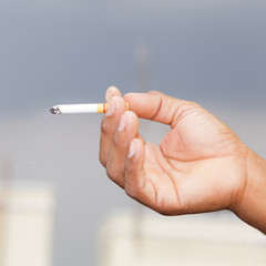 Cigarette in hand