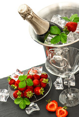 festive arrangement with bottle of champagne and strawberries