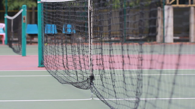 Tennis ball in net  on the game