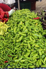 Fresh market produce of green chillies and peppers