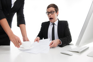 What are you doing? Stressed young businessman shouting at his s