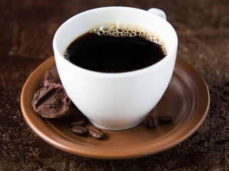 Coffee cup and chocolate