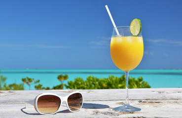 Sunglasses and orange juice