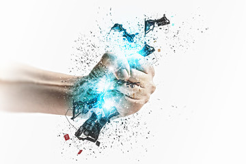 Fototapeta premium Hand squeezing keyboard