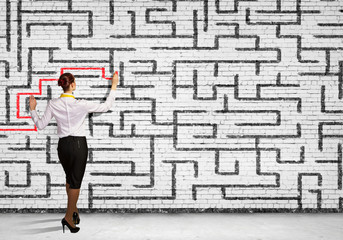 Businesswoman solving maze problem