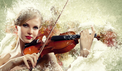 Gorgeous woman playing on violin