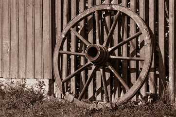 Fototapeta na wymiar Wooden wheel of a wagon
