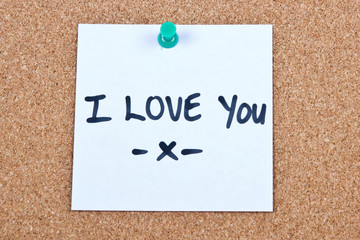 Post it note on wood