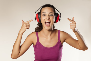 young brunette can not hear because of the anti loud headset