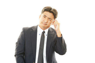 頭痛を訴えるビジネスマン
