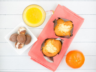 Breakfast with muffins ,juice, fruit and chocolate