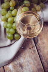 glass of white wine and grapes