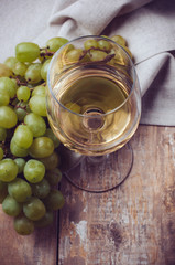 glass of white wine and grapes