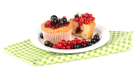 Tasty muffins with berries isolated on white