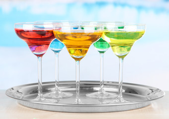 Different cocktails on bright background