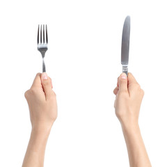 Woman hands holding a fork and a knife