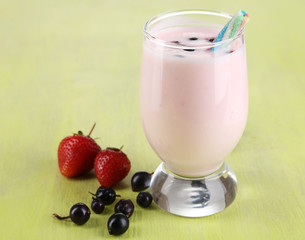 Delicious milk shake with blackberry and strawberries
