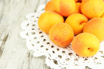 Naklejka na ściany i meble Fresh natural apricot on wooden table close up
