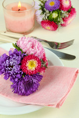Festive dining table setting with flowers