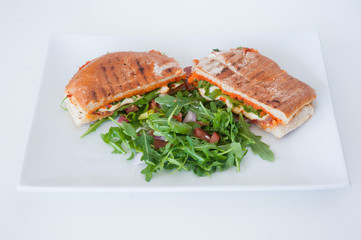 italian ciabatta panini sandwich with chicken and tomato