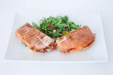 italian ciabatta panini sandwich with chicken and tomato