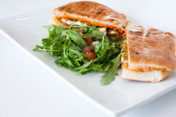 italian ciabatta panini sandwich with chicken and tomato