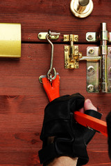 Robber breaks castle in door close-up
