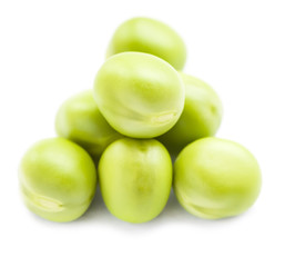 Green peas on a white. Macro shot with shallow depth of field.