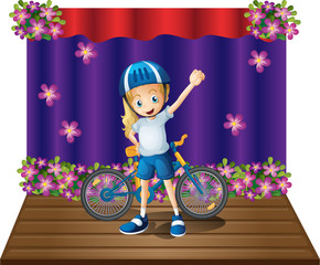 A stage with a female biker in the center