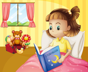 Obraz na płótnie Canvas A small girl reading a storybook inside her room
