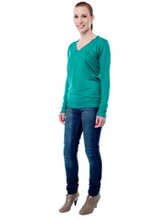 Fototapeta premium Cheerful young girl posing in trendy style