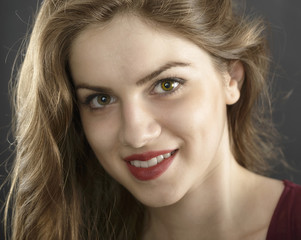 Naklejka premium long hair young woman with dark makeup, studio black background