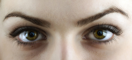 Naklejka premium Beautiful young woman's eyes close-up