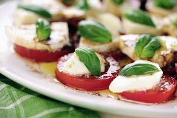 Fresh caprese salad with delicious tomatos + mozzarella and bas