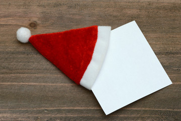 Fototapeta Weihnachtsmütze mit Zettel obraz