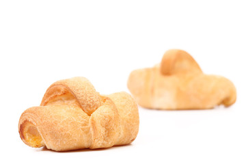 Two croissants on a white background