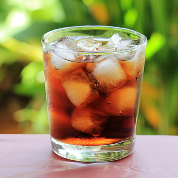 Fresh Cola in Ice cube a glass of water