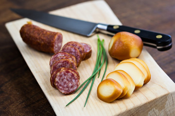 Sliced sausage and smoked cheese