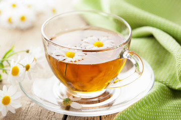 cup of herbal tea with chamomile flowers