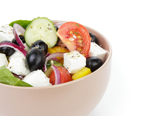 fresh greek salad in clay bowl