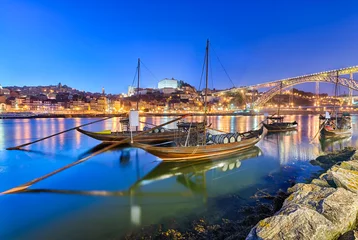 Gartenposter Traditional port wine transport boats in Porto, Portugal © Mapics