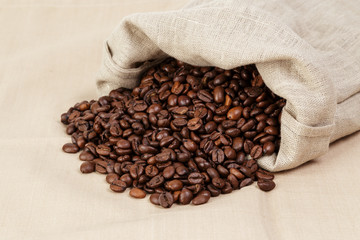 roated coffee beans spill out of the bag