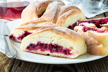 Baked cowberry pie in white dish