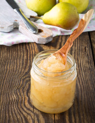 Homemade pear jam on  wooden board © istetiana