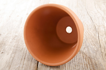 terracotta pot on an wooden board