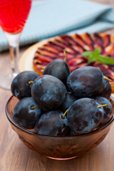 Plums in glass bowl